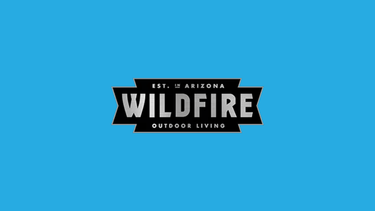 The Wildfire Grills logo on a sky blue background